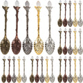 Set of decorative spoons in various metallic finishes on a white background
