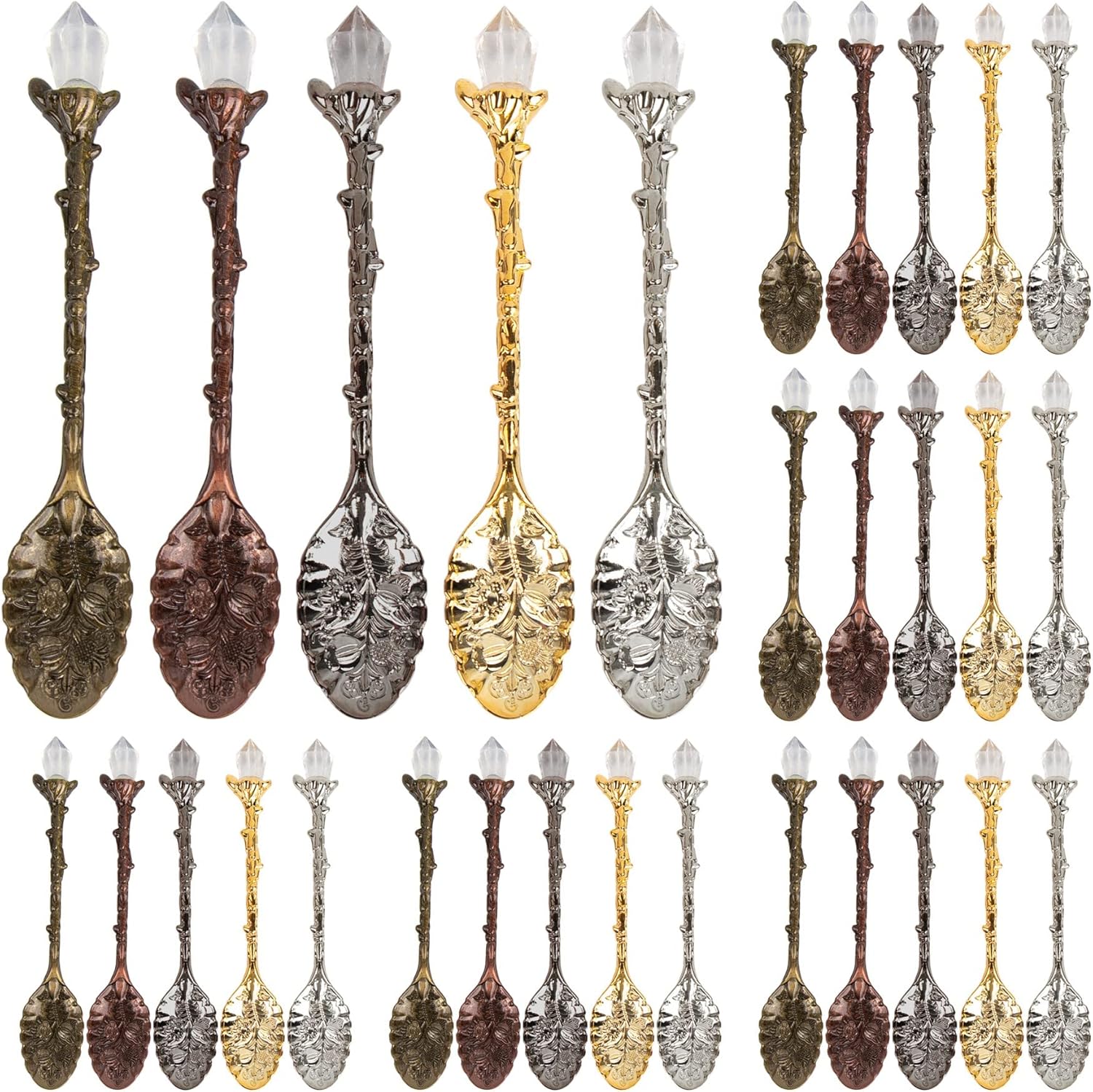 Set of decorative spoons in various metallic finishes on a white background