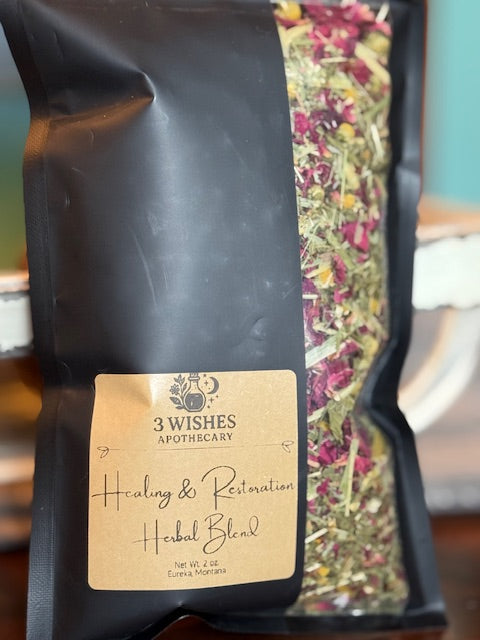 Black package of 'Healing & Restoration Herbal Blend' from 3 Wishes Apothecary with visible herbs.